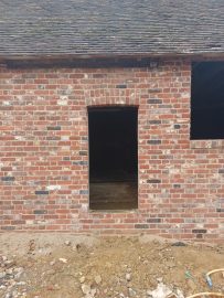 Historic arch dooryway into Milking Parlour